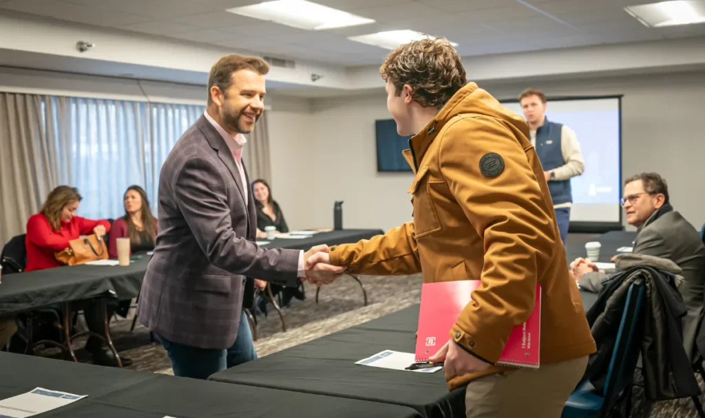 dean and leadership workshop attendee shaking hand