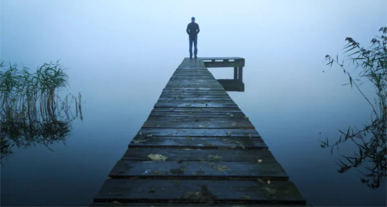 man on top of a pyramid